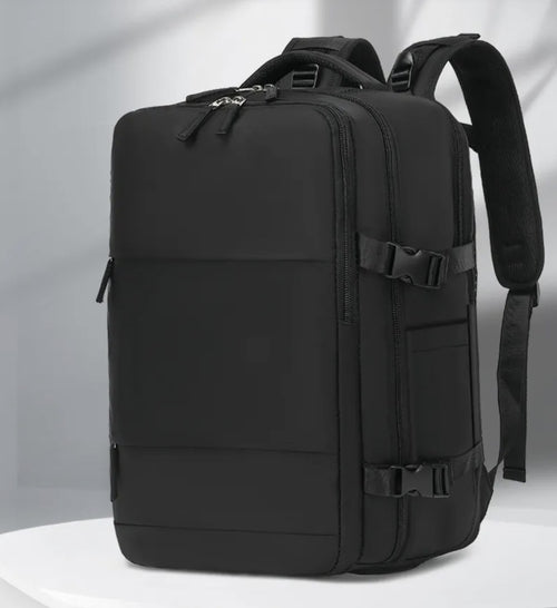 ViaLeggera AirPack in black, three-quarter view with the main compartment expanded
